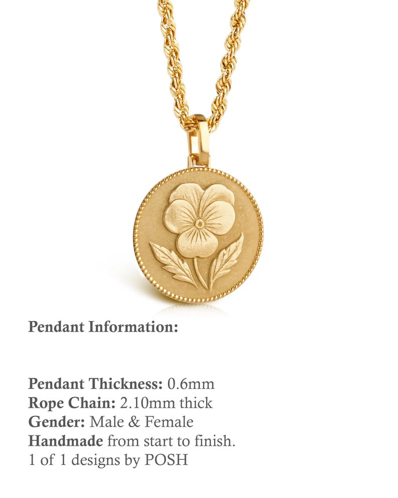 May include: A gold-toned necklace featuring a round pendant with a raised pansy flower design and a beaded border. The pendant has a thickness of 0.6mm and hangs from a rope chain that measures 2.10mm in thickness. The metal surface has a matte finish.