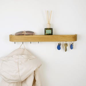 Minimalistic key holder made of solid oak wood, entry way key holder with hooks and shelf, simple coat rack for decorating hallway walls and organized mudroom.