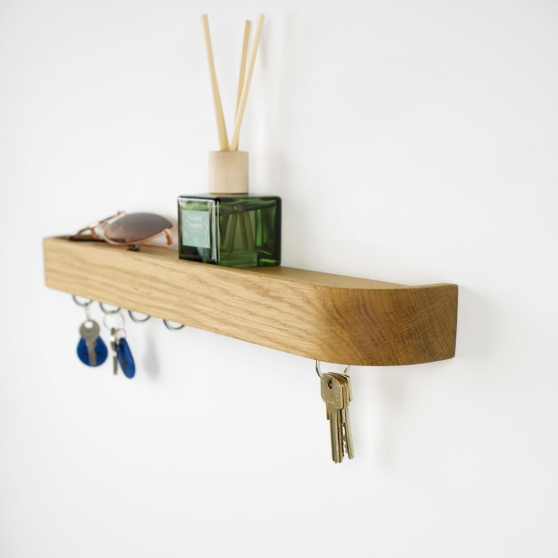 Minimalistic key holder wall mounted, entryway shelf rack made of solid oak wood, modern simple coat rack for hallway decoration.