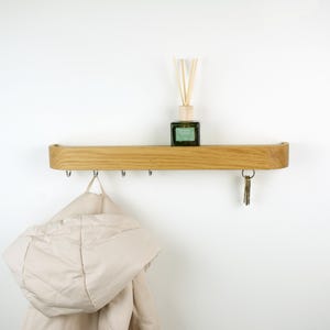 Wooden entryway shelf rack and simple coat rack, solid oak minimalistic key holder for keys and accessories in hallway decor.
