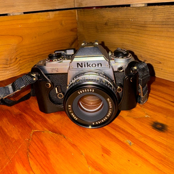 Vintage Nikon Camera with Leather cover/case + lense attachment