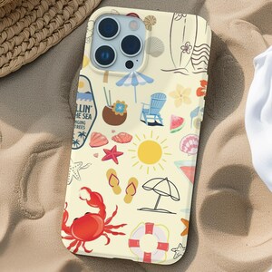 May include: A white iPhone case with a colorful beach-themed design. The design includes a crab, a surfboard, a coconut, a starfish, a watermelon, and the text "Chillin' by the Sea".
