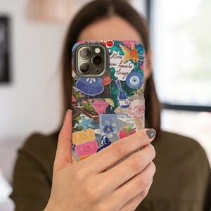 May include: A colorful phone case with a variety of images and text, including "Love your favorite things".