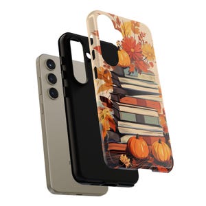 May include: A phone case with a fall-themed design featuring a stack of books, pumpkins, and autumn leaves. The case is made of a durable material and has a protective layer to prevent scratches and damage.