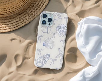 May include: A white phone case with a blue and white seashell and starfish design. The case has a camera lens cutout and a white background.