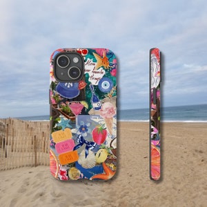 May include: A colorful phone case with a collage of images, including a seashell, a strawberry, a cocktail glass, a fish, and the text "Move your favorite things".