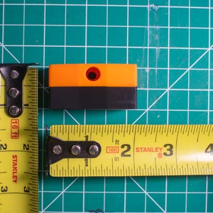 Ridgid bit holder with measuring tapes to show its measurements