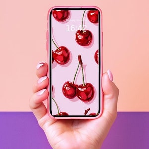 Könnte beinhalten: Ein rosa Smartphone mit einer Kirsch-Tapete. Die Uhrzeit auf dem Bildschirm ist 16:42.