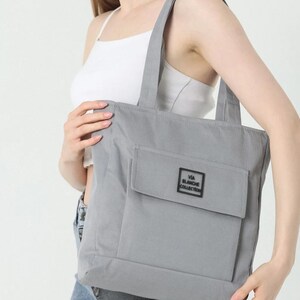 casual sports canvas tote bag with zippered two compartments and flap