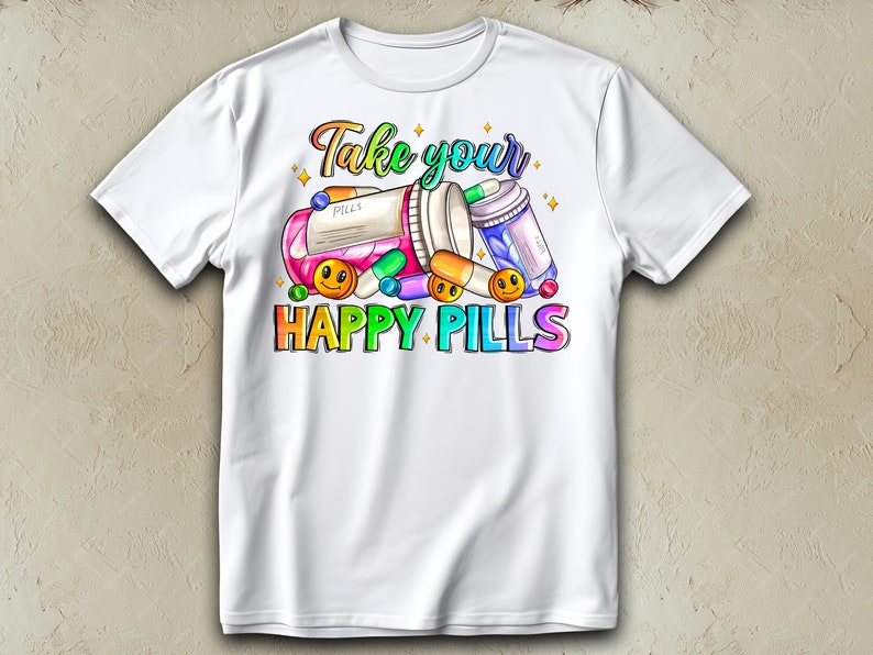May include: White t-shirt with a colorful graphic design of pills and the text "Take your happy pills".