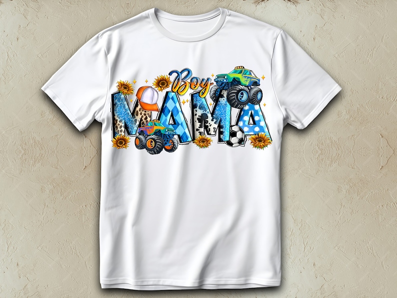 May include: White t-shirt with the words "Boy Mama" in a colorful design. The design includes monster trucks, sunflowers, a baseball cap, and a soccer ball. The letters are decorated with blue, black, and yellow patterns.