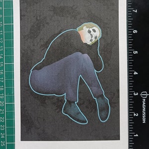 May include: A handmade wooden sign with the word "Welcome" in a whimsical font. It has a distressed white background and a dark stained wooden frame, suitable for a front door or hallway.