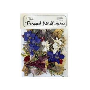 May include: A package of real pressed wildflowers. The flowers are a mix of blue, white, red, and yellow. The package has the text "Real Pressed Wildflowers" on the top.