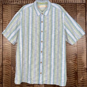 May include: A rustic wooden sign with the text "Welcome to our home" in white lettering. The sign features a distressed finish and a simple, inviting design, perfect for entryway decor.