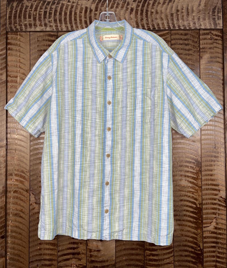 May include: A rustic wooden sign with the text "Welcome to our home" in white lettering. The sign features a distressed finish and a simple, inviting design, perfect for entryway decor.