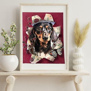 May include: A framed print of a black and brown dachshund dog with a butterfly on a red background with floral patterns.