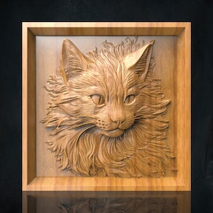 May include: A detailed wooden relief carving of a cat's face, set within a rectangular frame. The cat's fur is intricately carved, with visible whiskers and expressive eyes. The wood has a natural, light brown color.