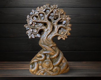 May include: A detailed, hand-carved wooden sculpture of a tree. The tree features a twisted trunk, leafy branches, and a detailed base. The sculpture is brown and sits on a wooden surface against a dark wood background.