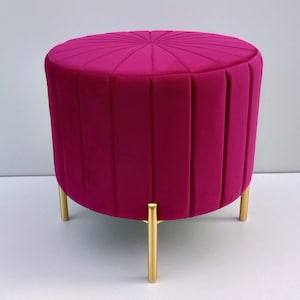 pink round pouffe, golden legs, bench, footstool