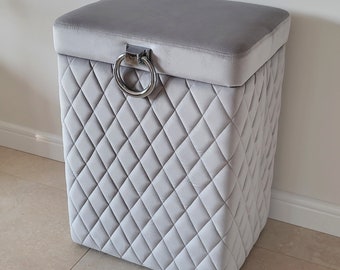 Gray upholstered laundry basket