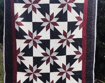 Hunter Star Lap Quilt - Black, and white with grey and cranberry star.