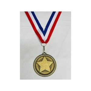 May include: A gold-colored medal with a five-pointed star in the center. The medal is surrounded by a rope-like border. The medal is attached to a red, white, and blue ribbon.