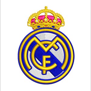 May include: Embroidered patch featuring the Real Madrid crest. The design includes a gold crown with pink accents atop a blue and gold emblem. The emblem has the letters "MCF" in gold.
