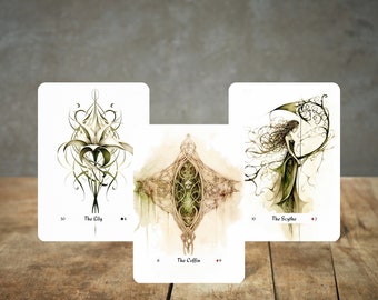 May include: Three tarot cards with intricate illustrations. The first card is The Lily, the second is The Coffin, and the third is The Scythe.
