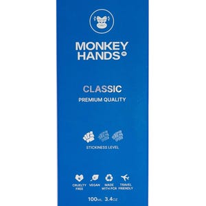 May include: Blue box with a monkey logo and the text "MONKEY HANDS" and "CLASSIC PREMIUM QUALITY". The box also has a stickiness level indicator, a list of product features, and the text "100ML 3.4oz".