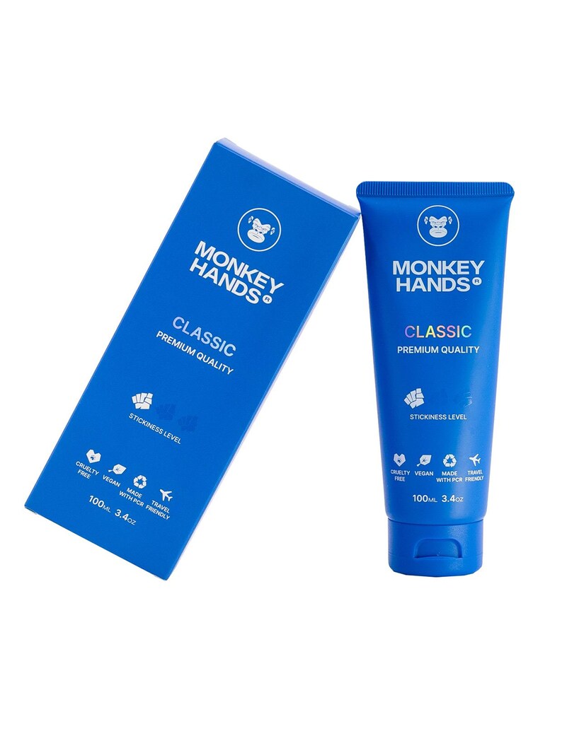 May include: Blue and white tube of Monkey Hands Classic premium quality lubricant. The tube is 3.4 oz and features a monkey logo and the text "Monkey Hands Classic Premium Quality".