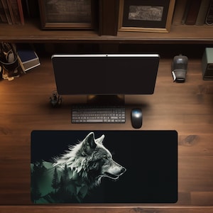 May include: A black and green mousepad with a white wolf silhouette on a dark background. The wolf's head is turned to the right and its eyes are closed. The wolf is surrounded by a green forest and mountains.
