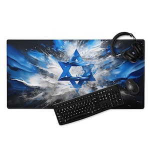 May include: A black keyboard and mouse are on a blue and white mousepad with a large blue Star of David in the center. The background is a blue and white abstract design.