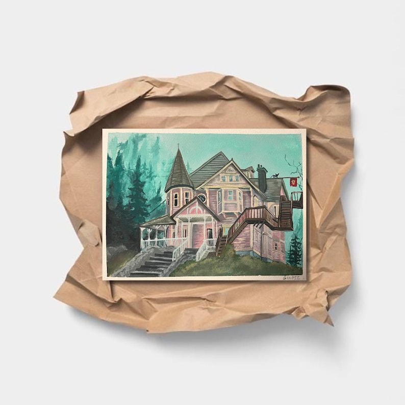 May include: A watercolor painting of a Victorian house with a pink and white exterior, set against a backdrop of green trees. The house features a tower, porch, and staircase. The artwork is presented on a white background, wrapped in brown paper.