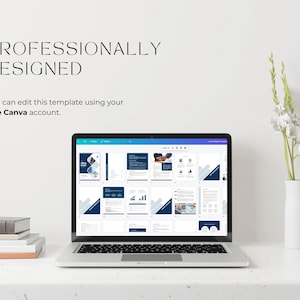 May include: A laptop displaying a digital report template with a white and navy blue design. The text "PROFESSIONALLY DESIGNED" is at the top, with the text "You can edit this template using your free Canva account." below. A stack of books and a vase with flowers are also present.