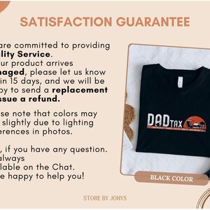 May include: Black t-shirt with the text "DAD TAX" in white and red, featuring a sunset graphic. The shirt is displayed on a white surface. The words "BLACK COLOR" are also visible.