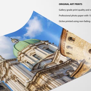 May include: A print of a European cathedral with a green dome and ornate architecture against a blue sky. The print is labeled "ORIGINAL ART PRINTS" and mentions gallery-grade quality, professional photo paper, and archival inks.