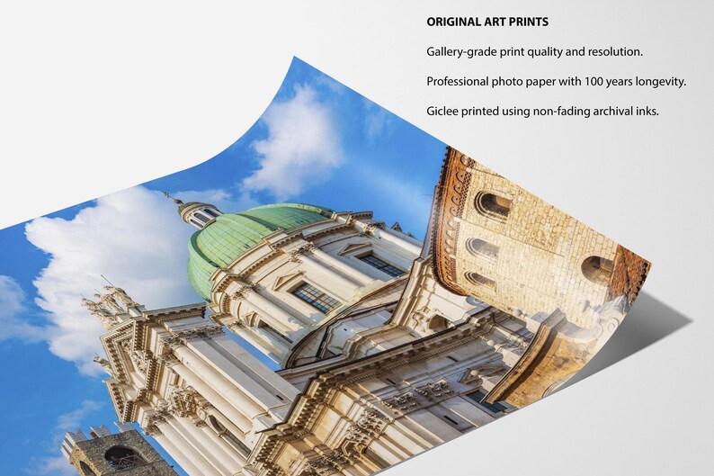 May include: A print of a European cathedral with a green dome and ornate architecture against a blue sky. The print is labeled "ORIGINAL ART PRINTS" and mentions gallery-grade quality, professional photo paper, and archival inks.