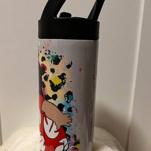 May include: A gray stainless steel water bottle with a black lid and handle. The bottle features a colorful graphic of a cartoon character wearing a red and white floral dress. The background of the graphic is a gray and white splatter pattern.