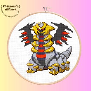 May include: Cross-stitch embroidery of a creature with yellow, black, red, and gray details, set in a wooden hoop. The design features a detailed character with spiky wings and a segmented body. The text "Christina's Stitches" is visible.