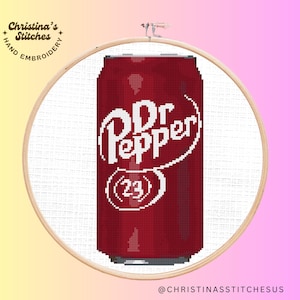 May include: Cross stitch pattern of a red and white Dr Pepper can with the text "Dr Pepper (23)" on the front.