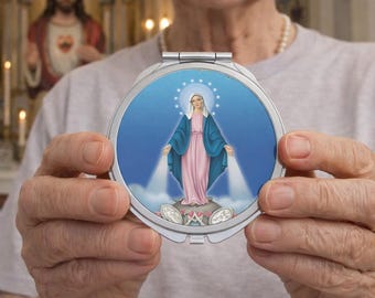 Notre-Dame de Grâce et une médaille, un miroir compact, un cadeau religieux, la Vierge Marie, un saint catholique