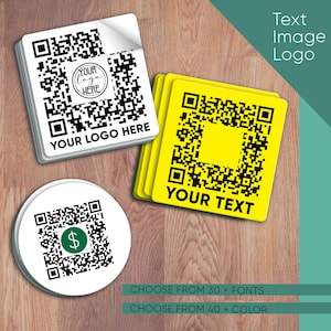 May include: Three different styles of customisable QR code stickers. The first sticker is white with a black QR code and the text "YOUR LOGO HERE". The second sticker is yellow with a black QR code and the text "YOUR TEXT". The third sticker is white with a black QR code and a dollar sign in the centre.