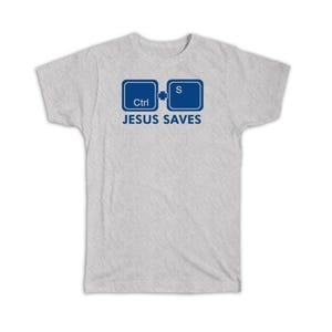 May include: Light gray t-shirt with a blue graphic of two computer keys and the words "JESUS SAVES" in blue. The shirt is made of a soft material and has short sleeves.