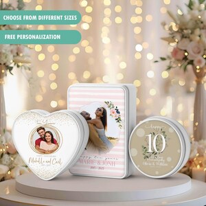 May include: Three personalised anniversary tins in heart, rectangular, and round shapes. The heart-shaped tin features a couple's photo and the text "Ten Years". The rectangular tin has a photo and the text "Happy the years". The round tin says "Happy 10th Anniversary".