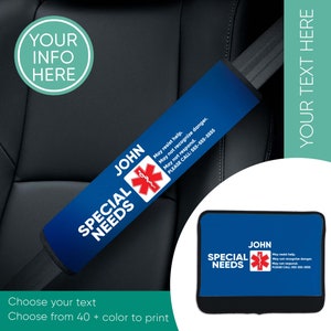 May include: Blue and white car seatbelt cover with the text "SPECIAL NEEDS" and a red medical symbol. The text "JOHN" is above the symbol. The text "May resist help. May not recognize danger. May not respond. PLEASE CALL: 555-555-5555" is printed on the cover.