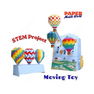 May include: A paper model kit featuring colorful hot air balloons with geometric patterns. The set includes a mechanical structure with a crank, labeled STEM Project and Paper Models World, displaying multiple balloons in flight over a landscape.
