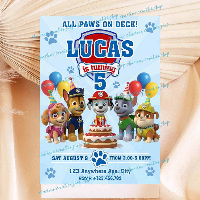 May include: A light blue birthday invitation featuring the text "ALL PAWS ON DECK!" and "LUCAS is turning 5". The invitation includes cartoon images of the Paw Patrol characters, balloons, and a birthday cake. The date and time are also included.