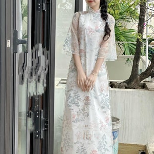 Vietnamese modern aodai ThuyMac white loose style