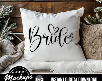 May include: A white square pillow with the word "Bride" in black script, featuring heart accents. The pillow is on a white faux fur surface, with a brown knitted pillow and greenery in the background. The image also includes the text "Instant Digital Download".