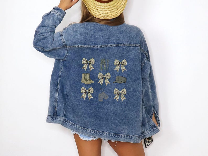 May include: A blue denim jacket with embroidered patches of camouflage bows, boots, and hats.